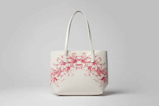 White tote bag with red/pink Lily Lei design on a mannequin
