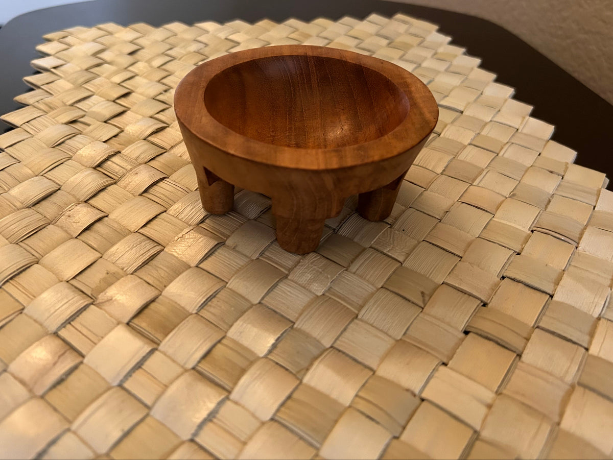 Overhead detail of a miniature Samoan tanoa handcrafted from ifilele wood